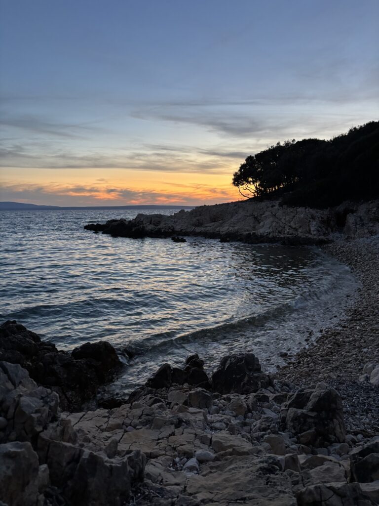 Sunset over a rocky beach